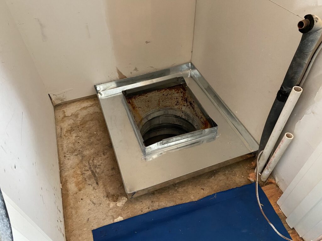 A metal ductwork base installed, preparing for a new HVAC unit by M&B Heating and Air in Charleston, SC.