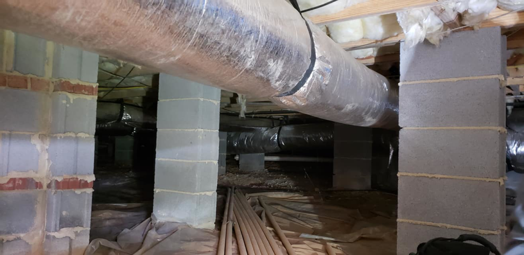 HVAC ductwork installation in a residential crawl space by Henson's HVAC LLC in Rock Hill, SC.