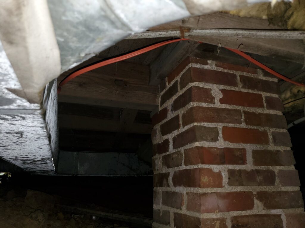 HVAC ductwork visible in a crawl space, indicating installation or maintenance by Brady Air & Home Repair LLC in Asheboro, NC.