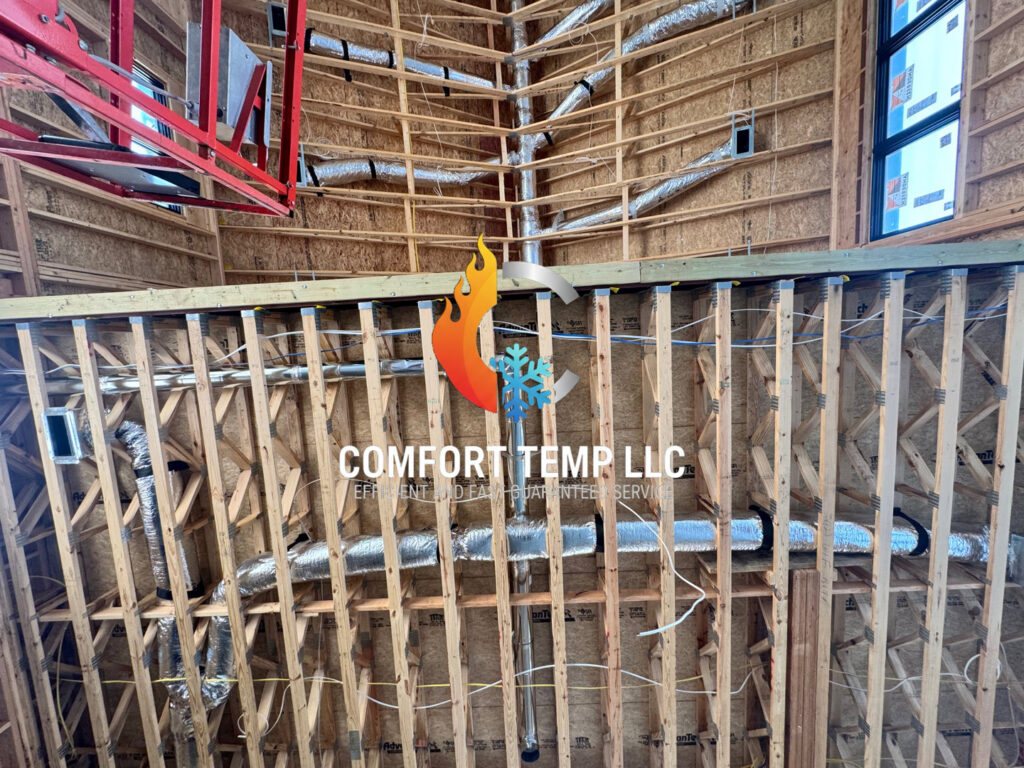 HVAC ductwork installed within the wooden framing of a new construction project by Comfort Temp HVAC LLC in Fort Smith, AR
