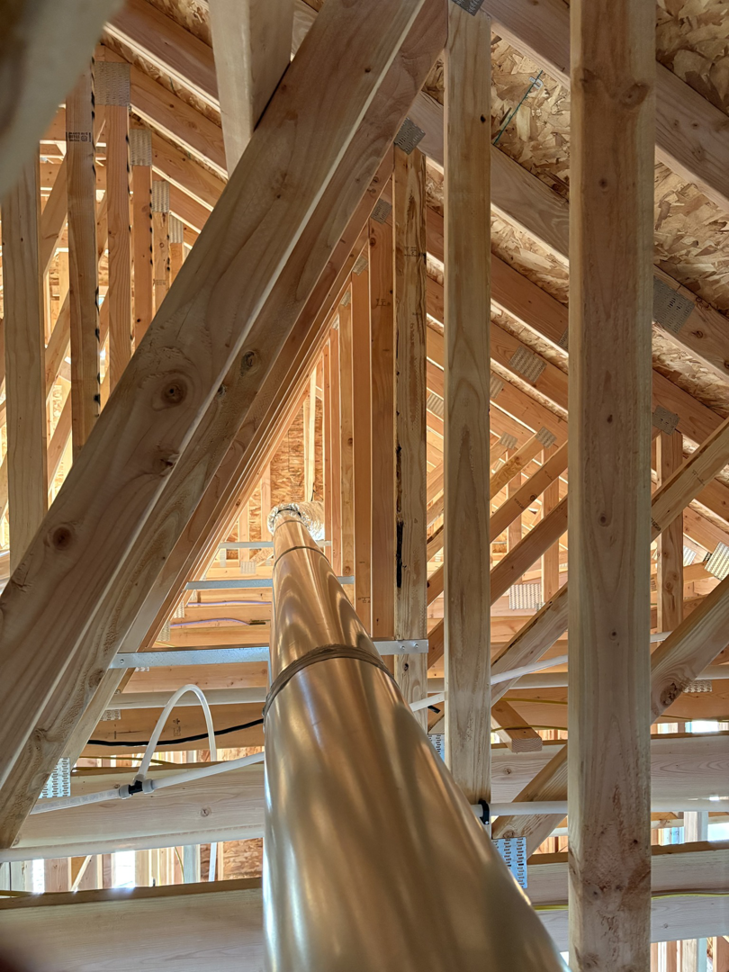 HVAC ductwork installed within the wooden framing of a new construction building by Atlas Heating and Air, LLC in Talent, OR