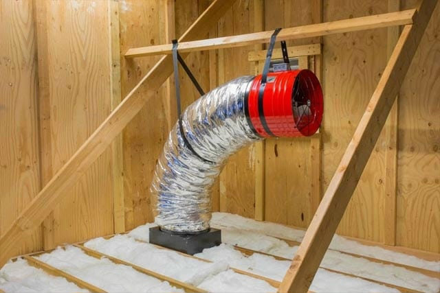 HVAC ductwork with an inline fan installed in an attic space by Absolute Plumbing, Electrical, Heating & Air in Denver, CO