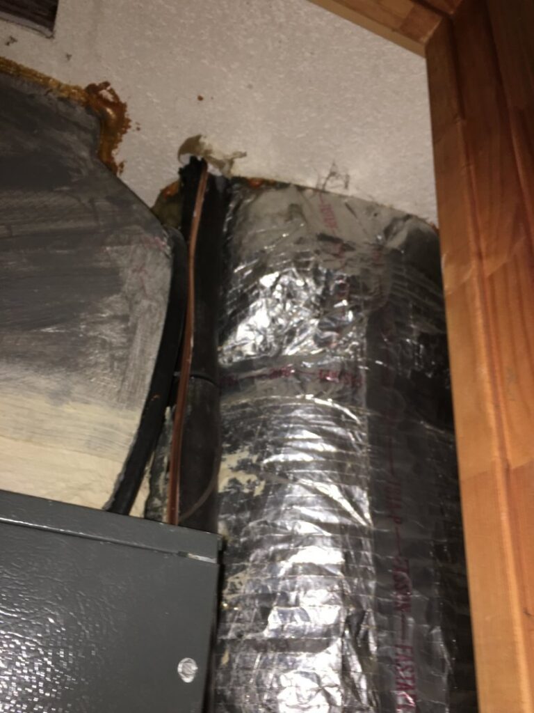 HVAC ductwork installation in a residential attic or crawl space by Air Control Heating and Cooling in Tallahassee, FL.