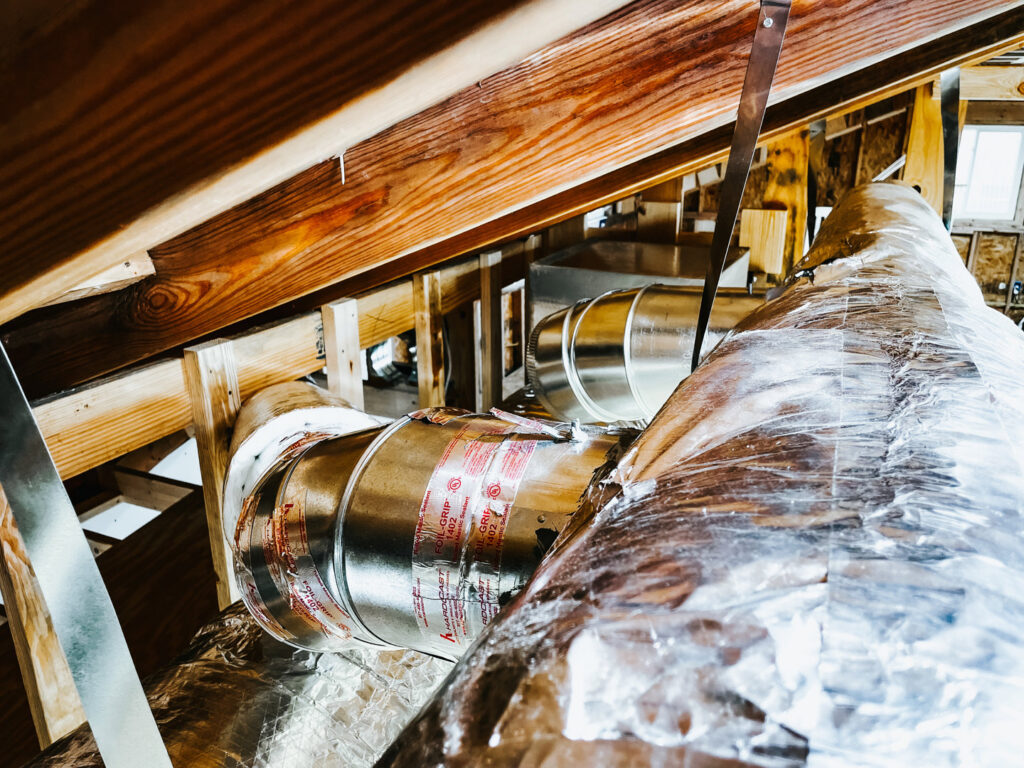 HVAC ductwork installation in an attic space by A & A Air Conditioning & Heating in Little Rock, AR.