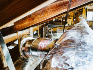 HVAC ductwork installation in an attic space by A & A Air Conditioning & Heating in Little Rock, AR.