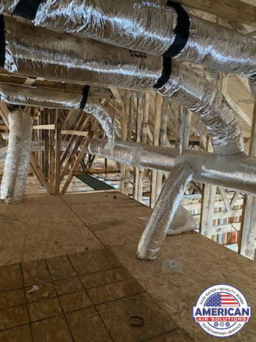 Newly installed flexible HVAC ductwork visible in an attic or unfinished space, part of an installation by American Air Solutions in Summerville, SC.