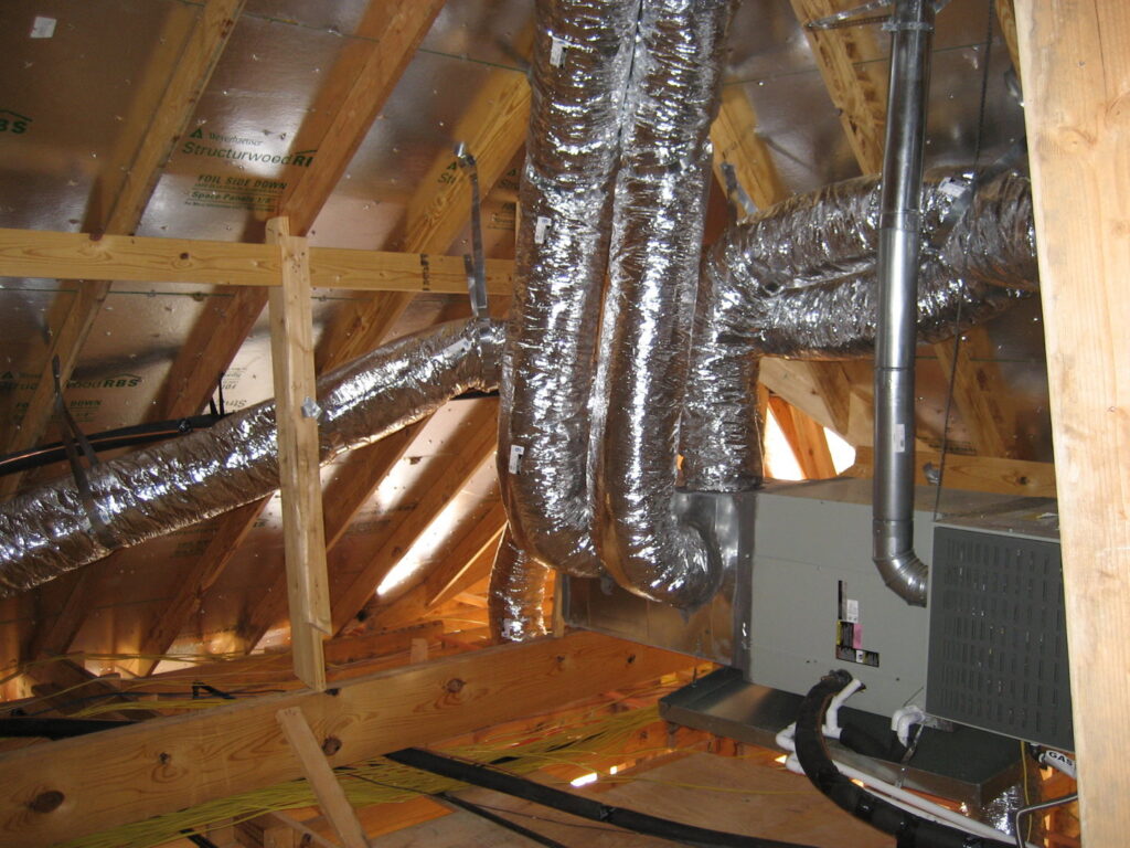HVAC ductwork installation in an attic space by Chapman Air and Heat in Dallas, TX