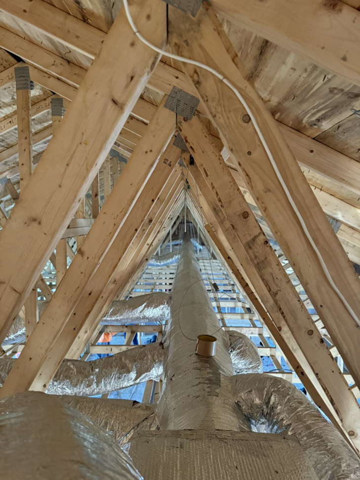 Extensive HVAC ductwork installation in an attic space by Ferreira Mechanical, LLC in Fall River, MA