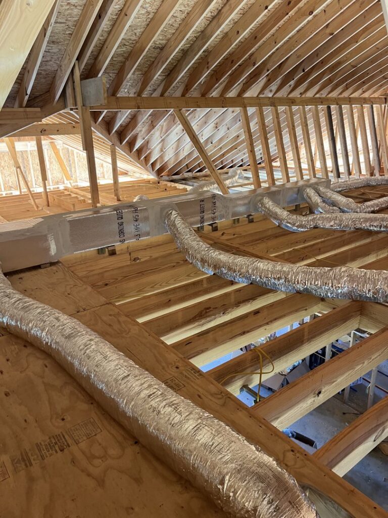 HVAC ductwork being installed in an attic or unfinished space by McGuffee's Air Conditioning and Heating in Gulfport, MS