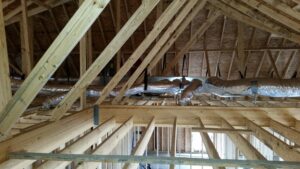 New HVAC ductwork being installed in an unfinished attic space by R&B Cooling&Heating in Abbeville, LA.