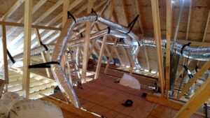 New HVAC ductwork being installed in an attic or unfinished residential space by Get RiTe A/C & Heating in Madisonville, LA.