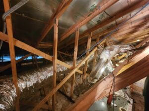 A wide view of HVAC ductwork installation and insulation in an attic by Seven Level Services Inc in Cape Coral, FL.