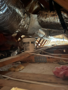 Insulated HVAC ductwork visible in an attic during installation or repair by West Mechanical in Summerville, SC.