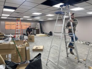 Wes-Tech Services technicians installing new HVAC ductwork in a commercial building in Bloomington, IN.
