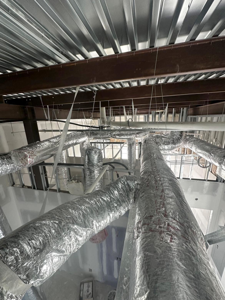 Insulated HVAC ductwork installed in a commercial building by G & N Heating and Cooling in Huntsville, AL.