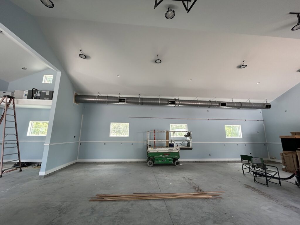 Newly installed exposed HVAC ductwork in a large commercial or residential space by Whitleys Heating and Air in Jacksonville, FL.