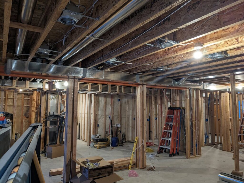 HVAC ductwork installation visible in the ceiling of a construction site by Inspector Rogers LLC in Draper, UT.