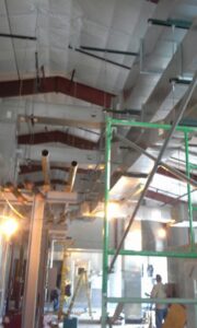 HVAC ductwork being installed in a commercial building under construction by Montefusco HVAC in Peoria, IL