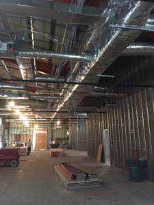Exposed HVAC ductwork and ventilation systems being installed in a commercial building by Accurate HVAC in Vacaville, CA.