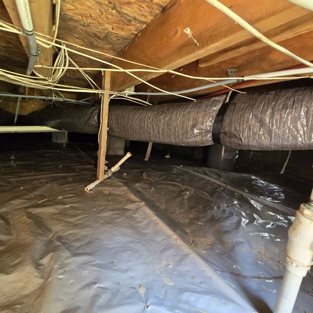 HVAC ductwork installation and insulation in a crawl space by Pappy's Heating & Air INC, serving Clayton, NC.