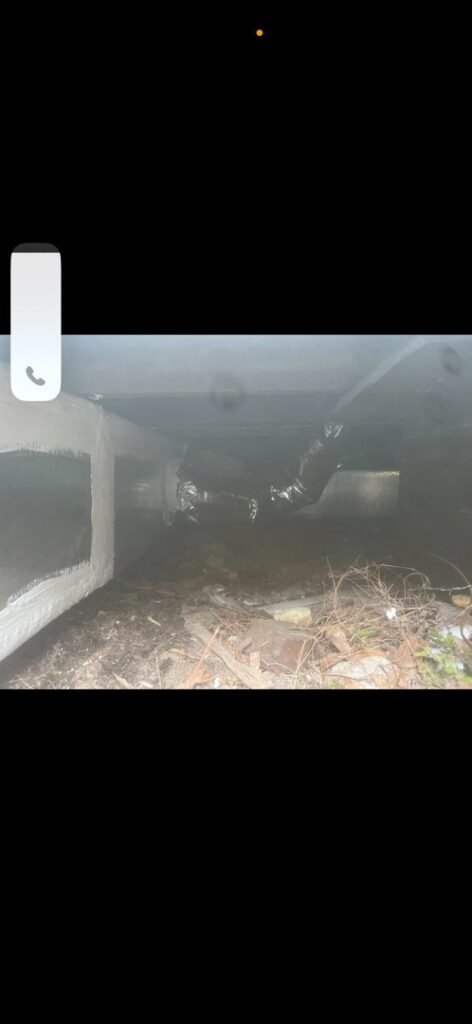 Insulated HVAC ductwork installed in a crawlspace under a house by Budget Heating and Air in Mobile, AL.