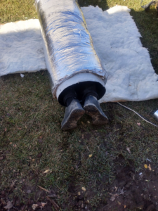 A technician performing ductwork installation or repair for GS Heating and Air LLC in West Columbia, SC