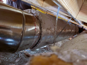 Close-up of new HVAC ductwork installation in a crawl space by Janssen HVAC & Air Duct Services in Mount Pleasant, SC.