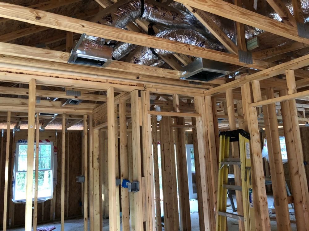 HVAC ductwork installation in the framing of a new construction home by Coral Air Conditioning in Cape Coral, FL.
