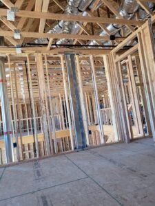 Large metal HVAC ductwork installed during the rough-in phase of new home construction by Integrity Heating And Air LLC in Nampa, ID