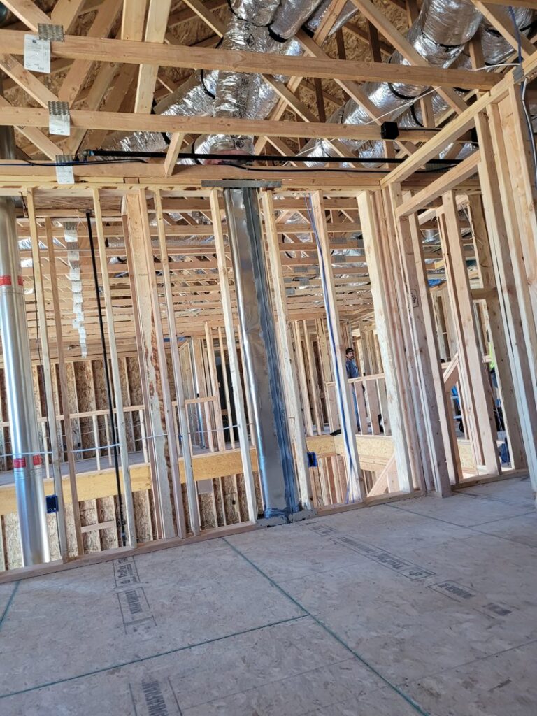 Large metal HVAC ductwork installed during the rough-in phase of new home construction by Integrity Heating And Air LLC in Nampa, ID
