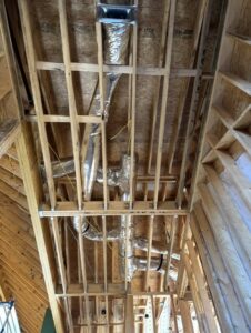 Extensive HVAC ductwork being installed in the ceiling of a new home construction project by Triune Air in Smithville, TN.