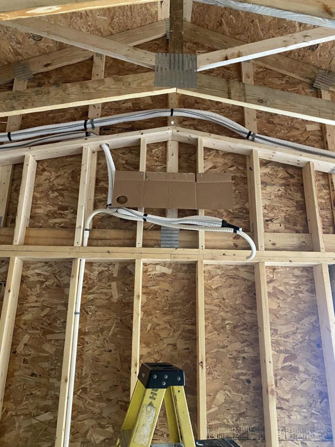 HVAC ductwork and lines being installed in a new construction attic by ProTec in Bakersfield, CA.