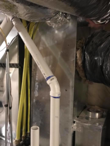 Interior view of HVAC ductwork and piping during an installation or repair by Bergmann Heating & Air Conditioning, LLC in Orem, UT