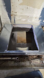 An open section of HVAC ductwork during installation or repair by Warren Mechanical, LLC in Carmel, IN.