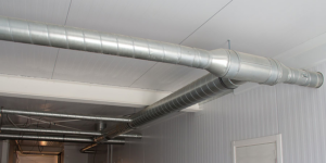 Newly installed metal HVAC ductwork running along a ceiling by S&S Mechanical in St. George, UT