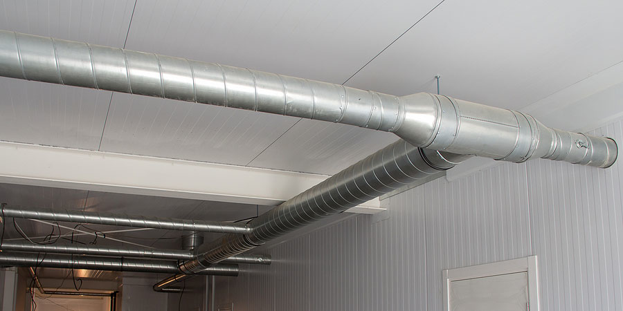 Newly installed metal HVAC ductwork running along a ceiling by S&S Mechanical in St. George, UT