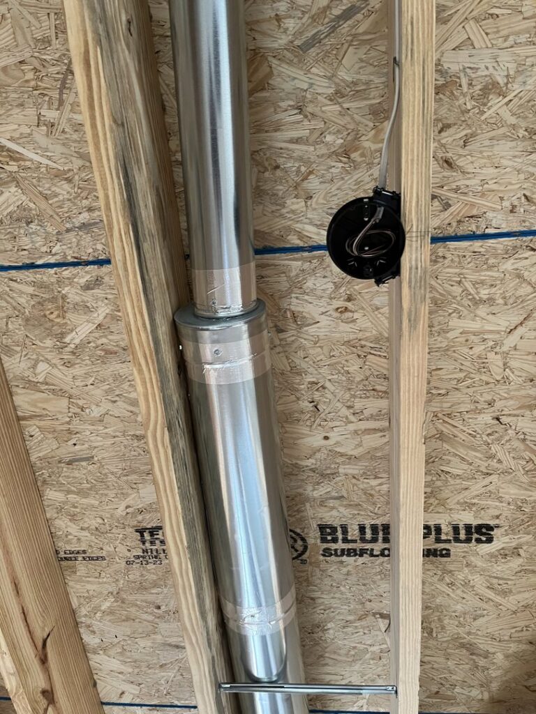 HVAC ductwork and piping being installed within wall studs by Steve's Heating & Cooling in Florence, KY.