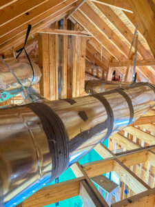 Large metal HVAC ductwork installed in an attic or ceiling space by Texas Air & Heat in Arlington, TX.