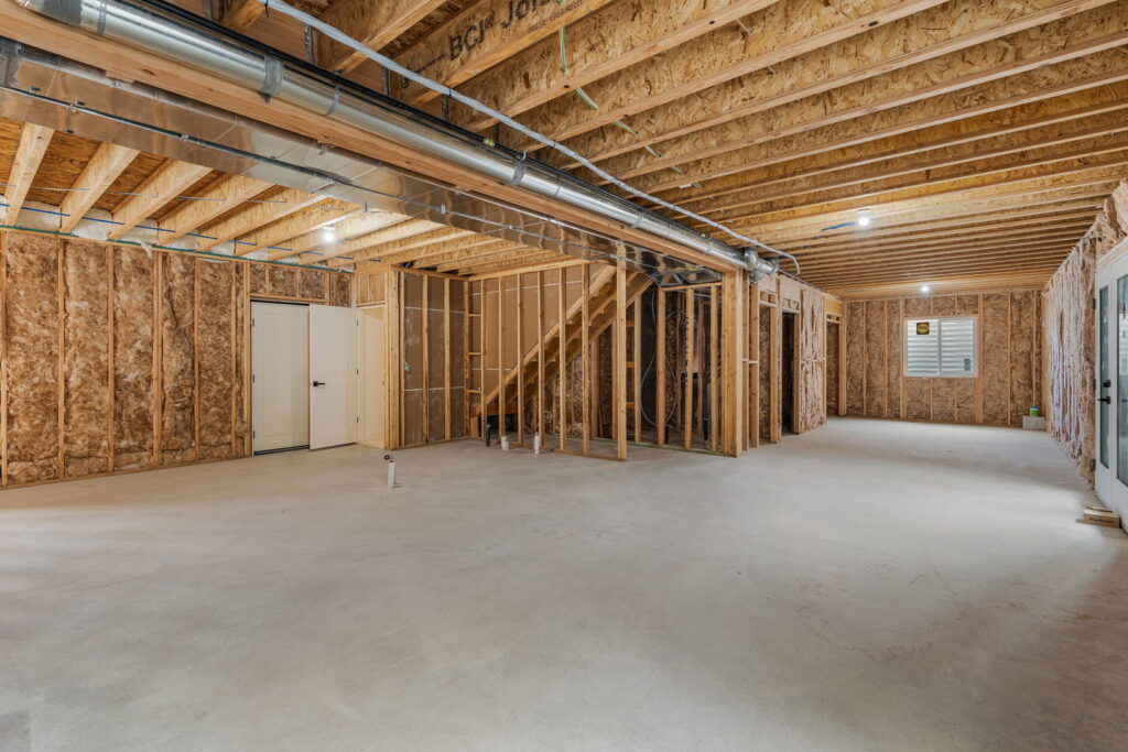 HVAC ductwork installed in the ceiling of an unfinished basement by LUCAS Heating And Air LLC in Salt Lake City, UT.
