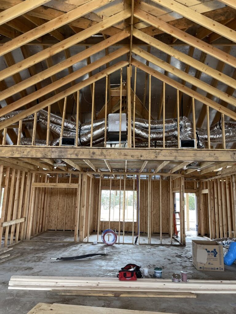 HVAC ductwork and units installed in a framed attic space during new construction by Jupitair in Frisco, TX.