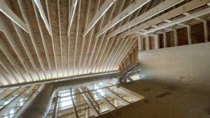 Long run of HVAC ductwork installed in a residential attic space by Paul Mechanical LLC in Merrimack, NH