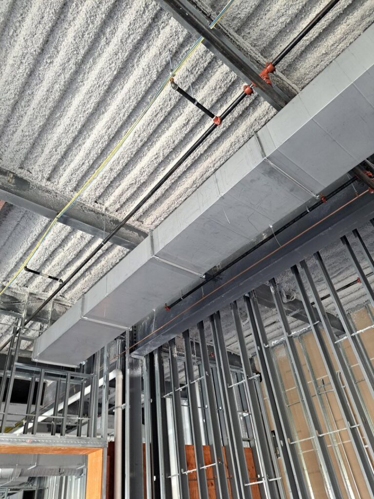 Rectangular HVAC ductwork and sprinkler system installation in a commercial ceiling by Central Consolidated in Wichita, KS