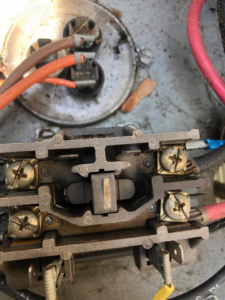 Close-up of an HVAC electrical contactor and wiring being serviced by L.N.P Heating & Cooling in Columbus, OH