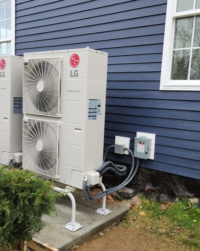 Outdoor HVAC unit electrical installation with conduits and disconnect box by Flex Electric LLC in Boston, MA