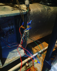 Detailed electrical wiring connections inside an HVAC unit by B & H Heating and Air Services LLC in Local City, ST.