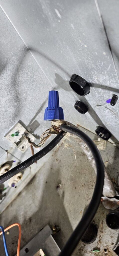 Close-up of electrical wiring and connections inside an HVAC unit during a repair by Anubis Mechanical in Goose Creek, SC.
