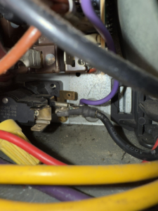 Close-up of electrical wiring and components inside an HVAC unit during a repair by Direct Service HVAC & Maintenance in Lewisburg, OH.