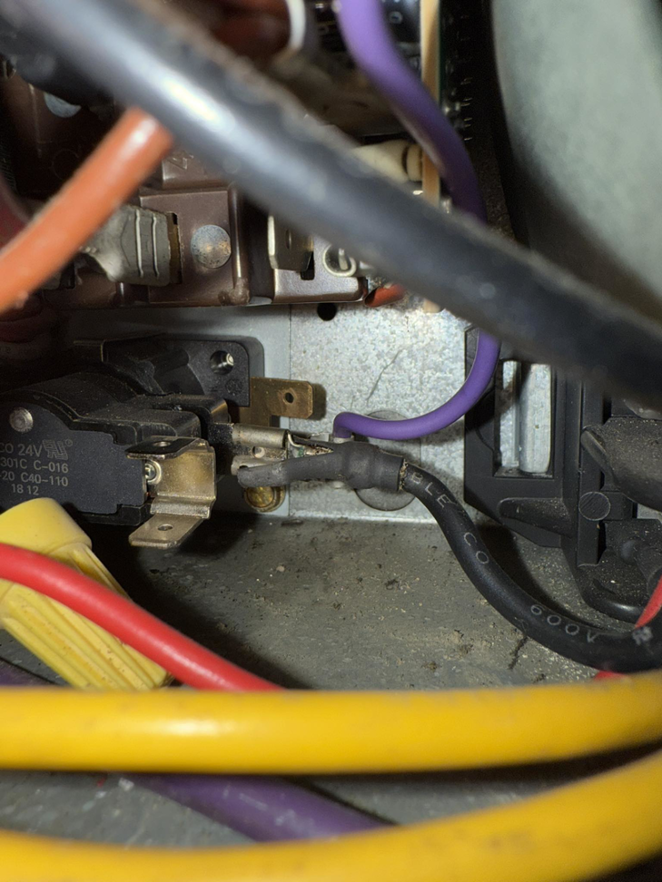 Close-up of electrical wiring and components inside an HVAC unit during a repair by Direct Service HVAC & Maintenance in Lewisburg, OH.