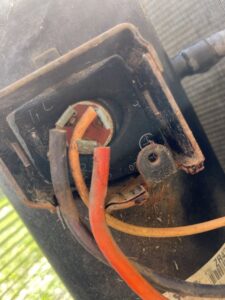 Close-up view of electrical wiring connections inside an HVAC unit, demonstrating detailed repair and service work by DeltaCool in Jonesboro, AR.