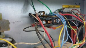 Close-up of electrical wiring inside an HVAC unit being repaired by Service Experts Phoenix in Phoenix, AZ.